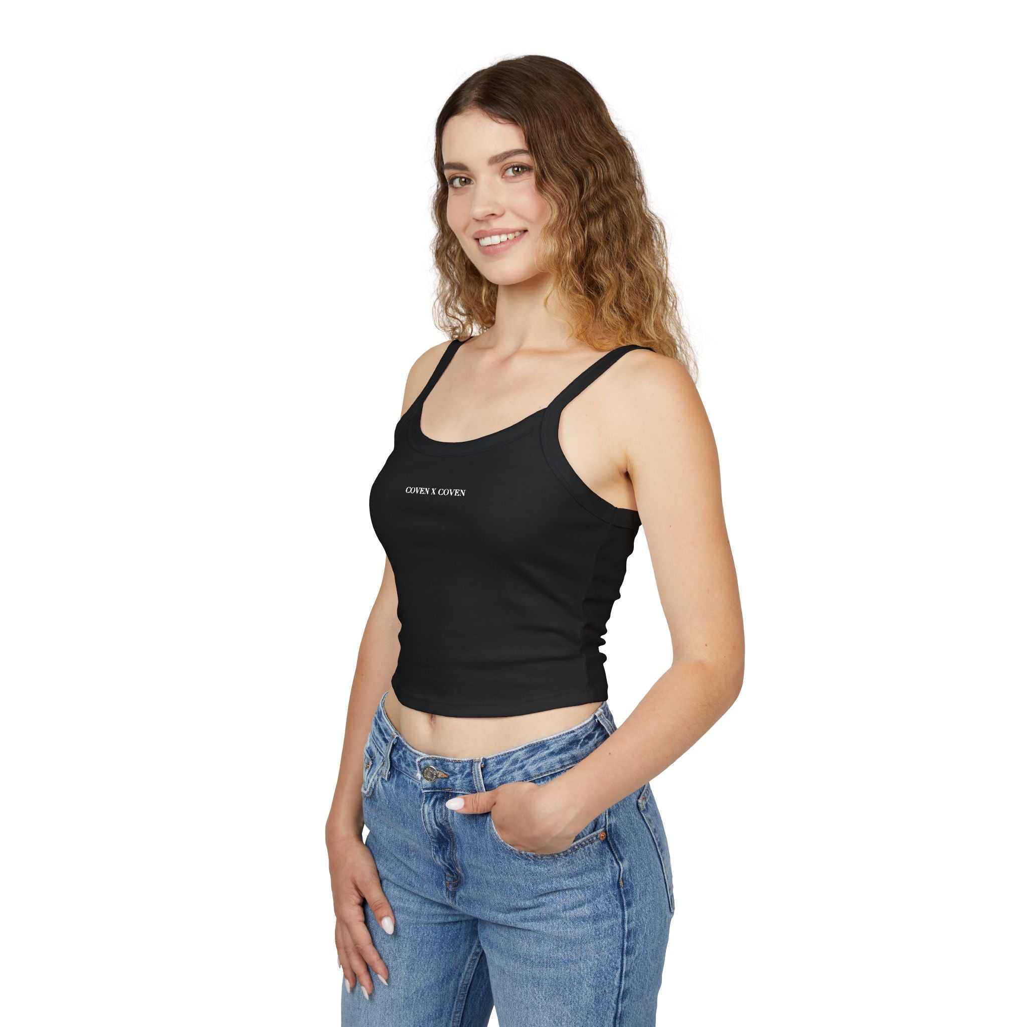 Side view of model wearing Coven x Coven spaghetti strap tank top – black crop top with minimal logo, paired with jeans for gothic style