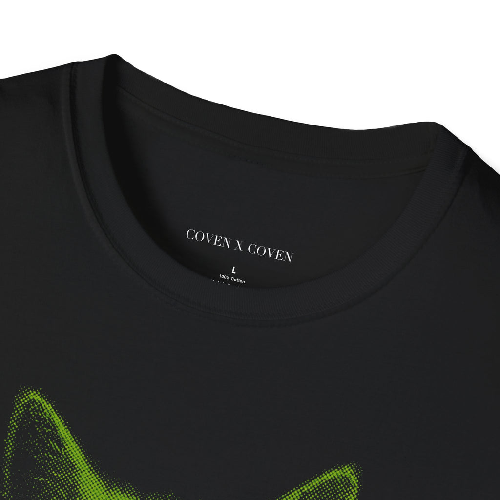Close-up of Cat Venom T-shirt collar – black unisex T-shirt showing 'Coven x Coven' label and neon green cat head with snake graphic, gothic streetwear style