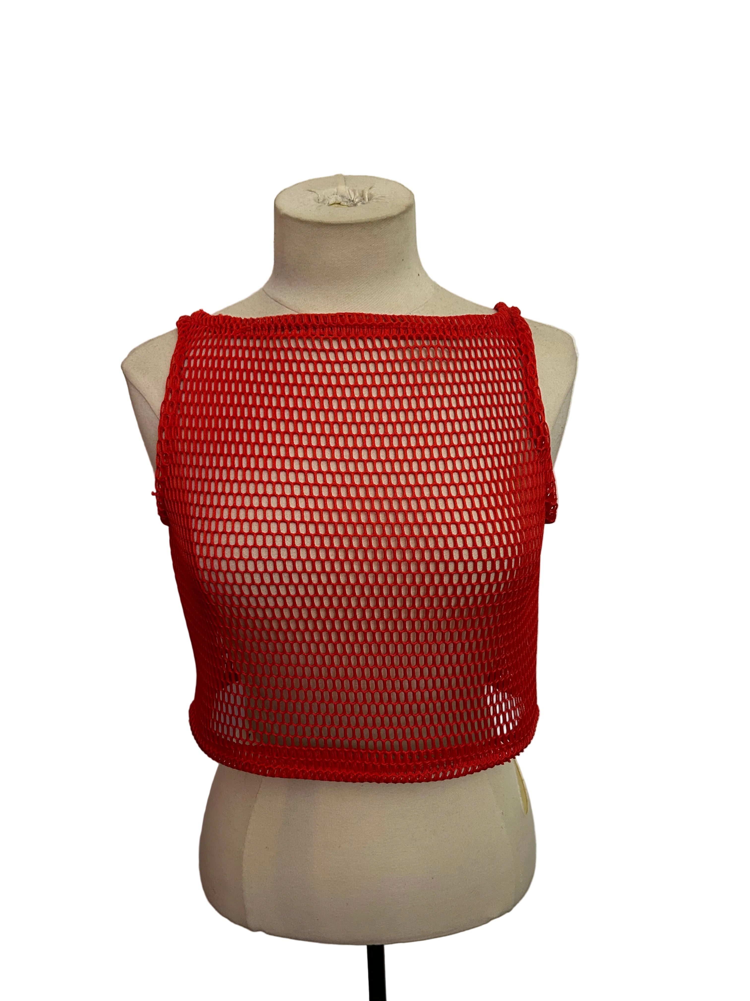 Red mesh vest on a mannequin against a black background