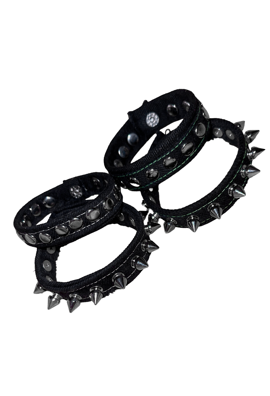 Three black studded Denim cuffs with silver-toned spikes and metal rivets, arranged on a plain white background.