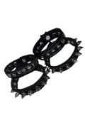 Three black studded Denim cuffs with silver-toned spikes and metal rivets, arranged on a plain white background.